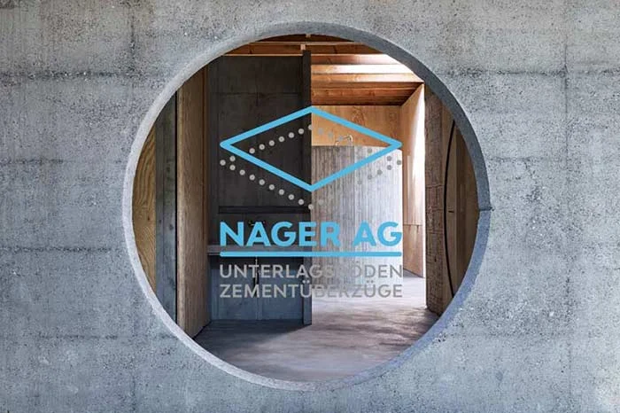 Rundes Fenster mit Logo der Nager AG